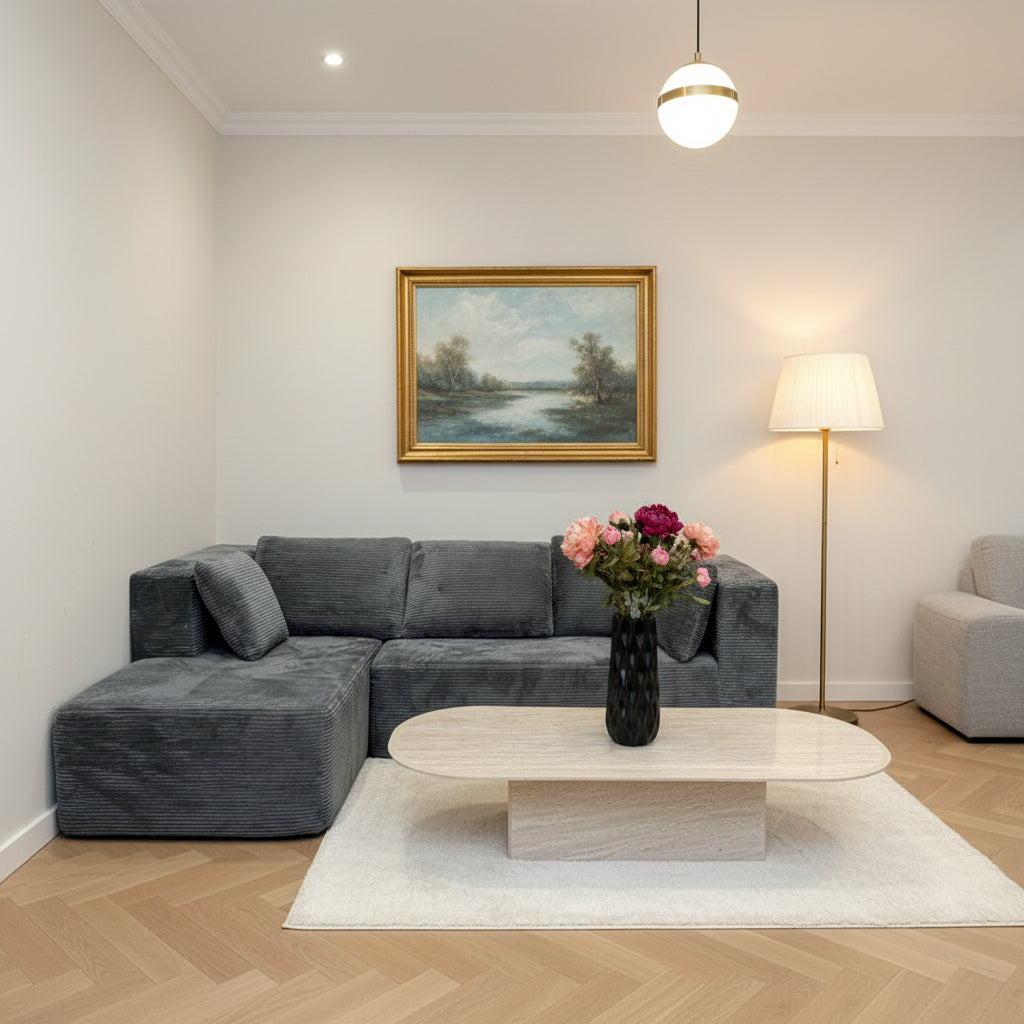 Gray textured sofa with a white wall and light-colored floor in the background
