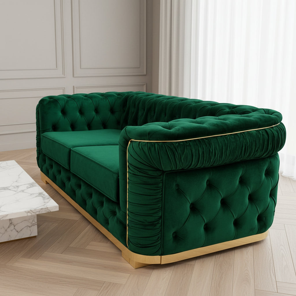 Green velvet sofa with tufted backrest on a black marble floor, branded 'Velora Living'.